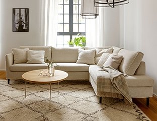 5 Seater Corner Sofa Designed By Adventures In Furniture. These Handmade Sofas Have Endless Fabric Choices To Fit Every Space In Your Home. This Sofa On Show Has Wooden Legs With A Matching Coffee Table