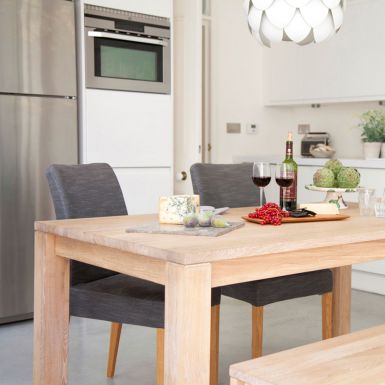 extending dining table made from solid oak dark brown