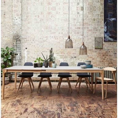 modern and solid oak extendable dining table that saves space